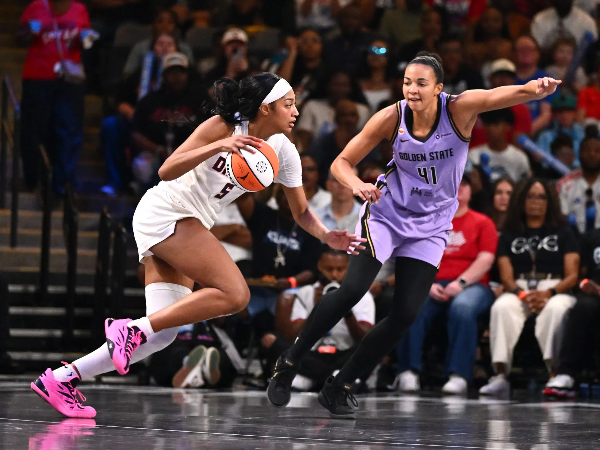 Atlanta Dream and Golden State Valkyries players compete during a game